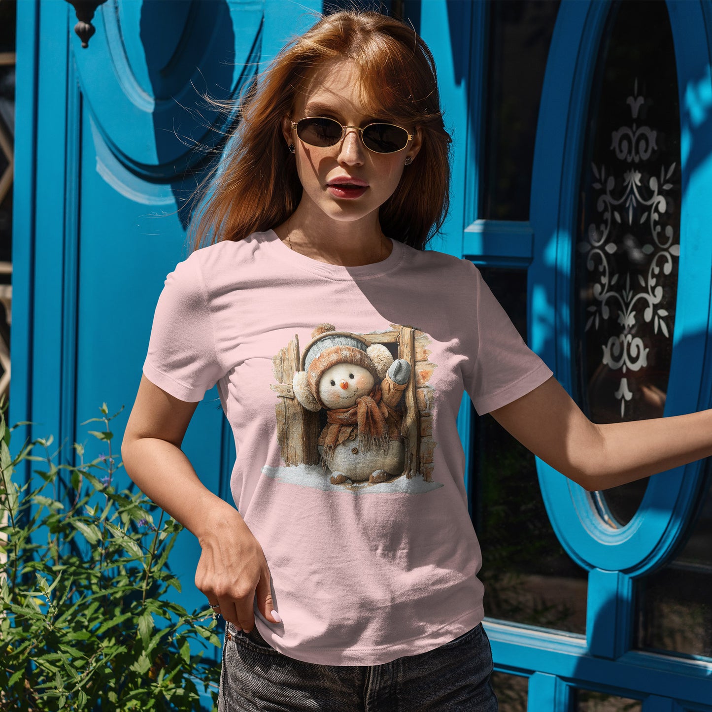 Waving Doorway Snowman Christmas T-Shirt - Cabin Snowman in Beanie & Ear Muffs