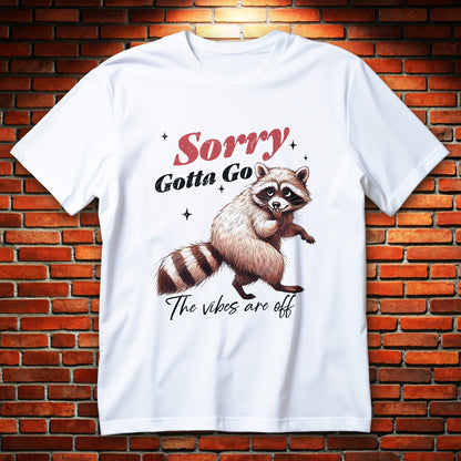 sorry raccoon t-shirt - shy raccoon with paw to mouth and sorry gotta go text, cute apology graphic