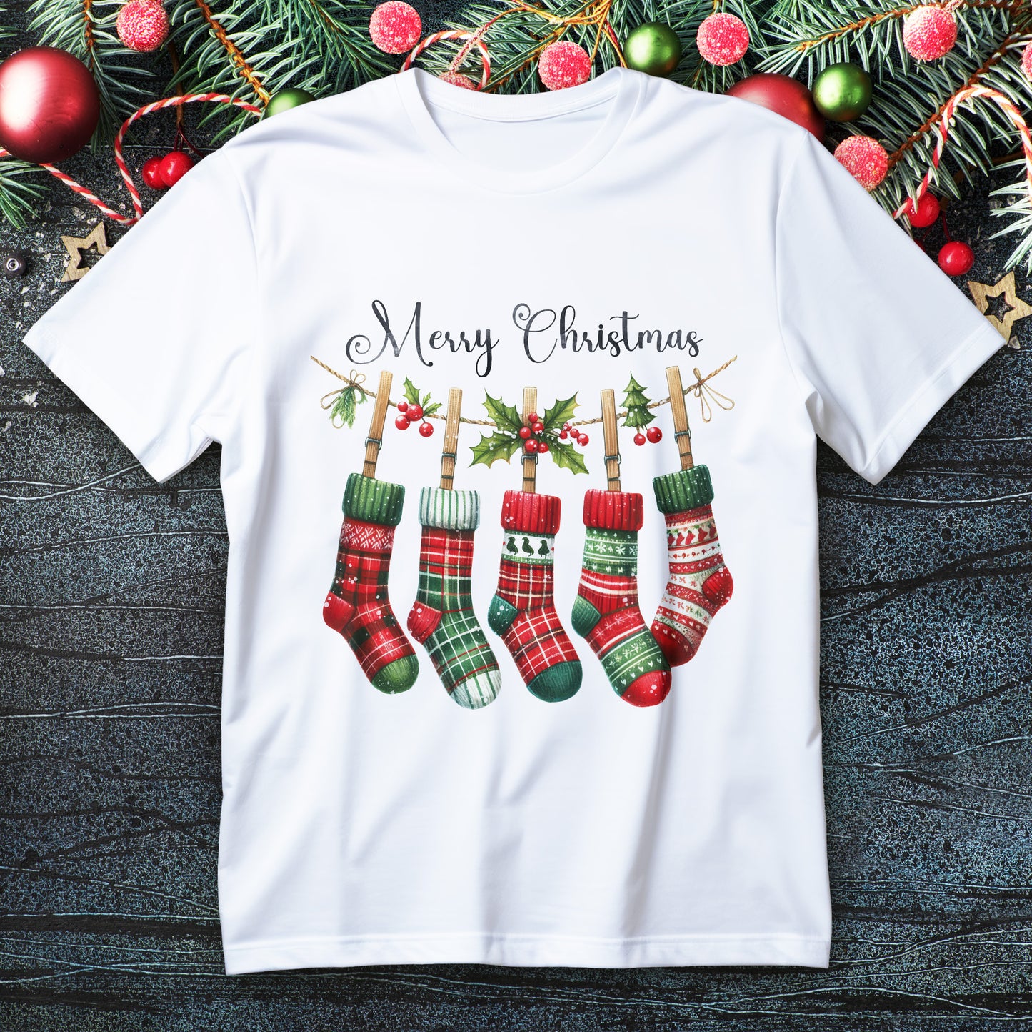 Five plaid Christmas stockings hanging on a holly garland with “Merry Christmas” script