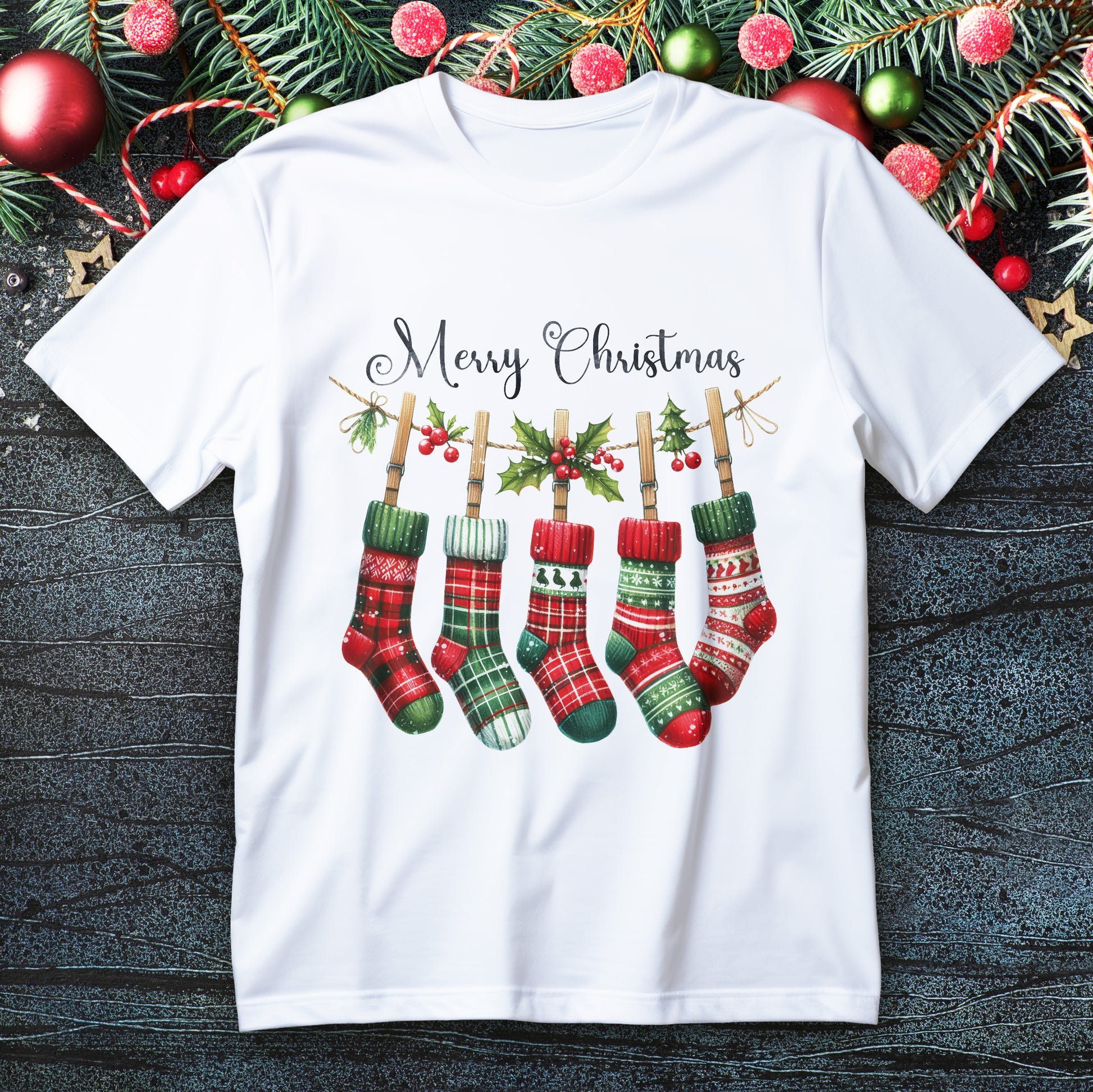 Five plaid Christmas stockings hanging on a holly garland with “Merry Christmas” script