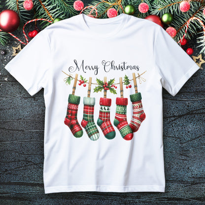 Five plaid Christmas stockings hanging on a holly garland with “Merry Christmas” script