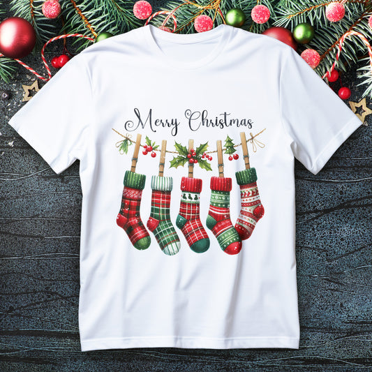 Five plaid Christmas stockings hanging on a holly garland with “Merry Christmas” script