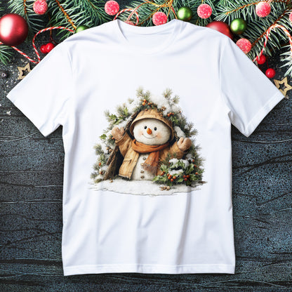 Snowman in coat and scarf peeking from pine and holly wreath on a Christmas T-shirt
