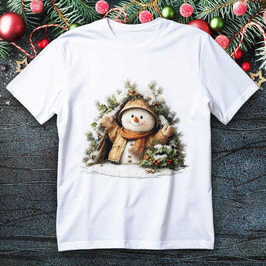 Snowman in coat and scarf peeking from pine and holly wreath on a Christmas T-shirt
