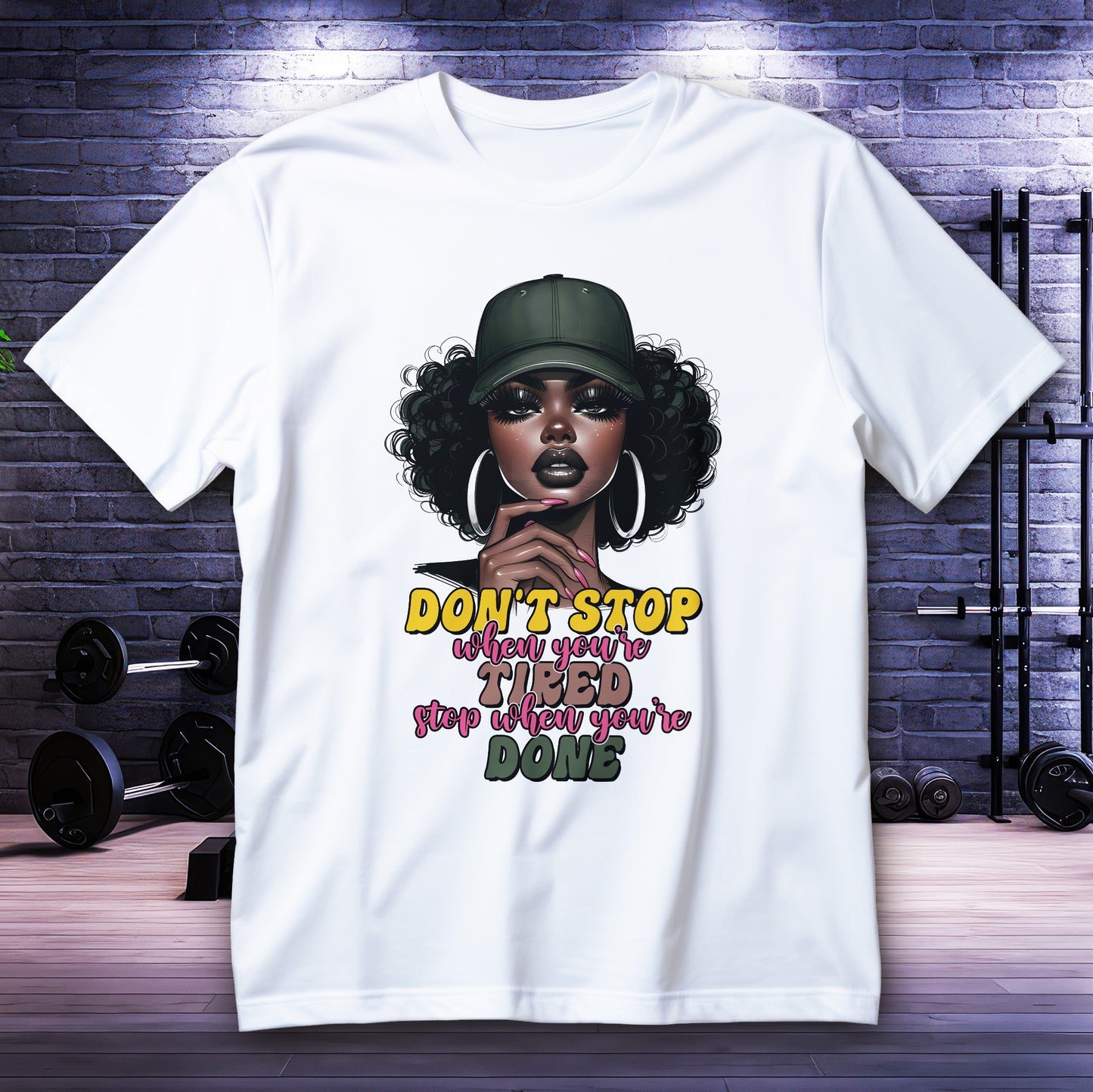 Motivational Black girl graphic with quote “Don’t stop when you’re tired, stop when you’re done” on tee